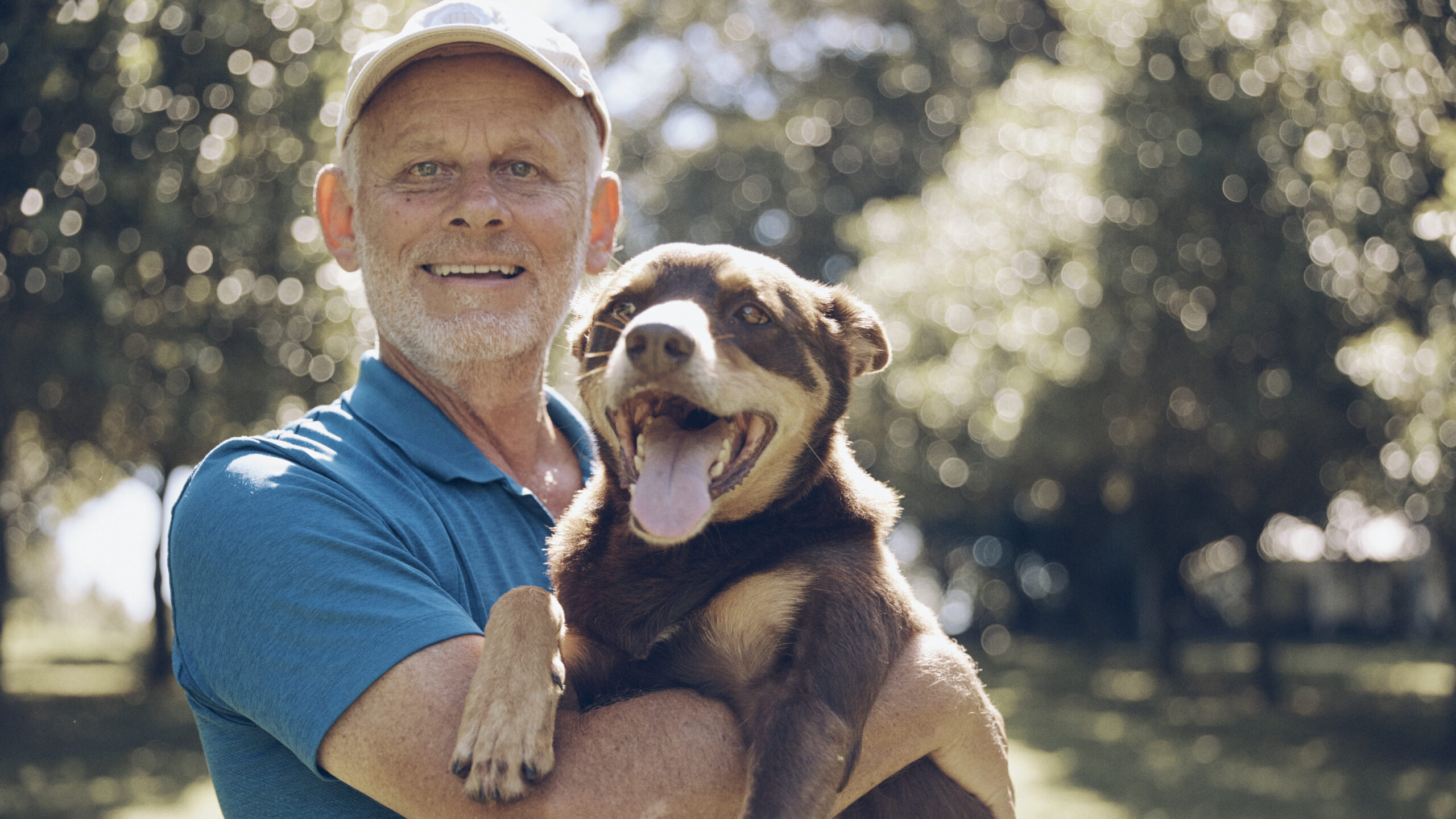 Macadamia farmer Ross Arnett with his dog Red