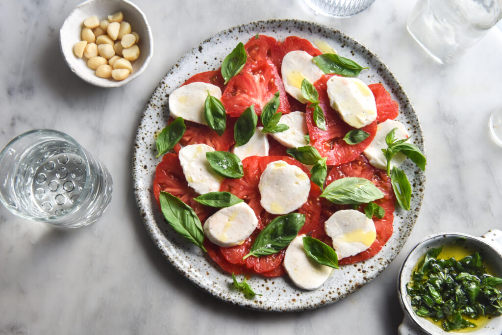 Vegan macadamia mozzarella in a caprese salad