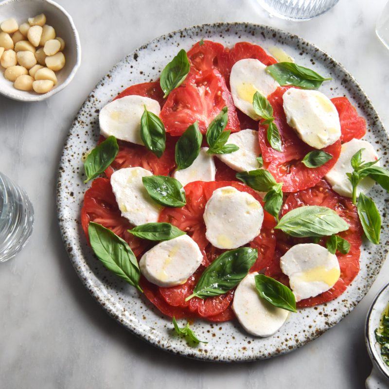 Vegan macadamia mozzarella in a caprese salad